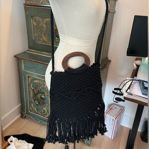 Boho crochet crossbody bag with brown wooden handle